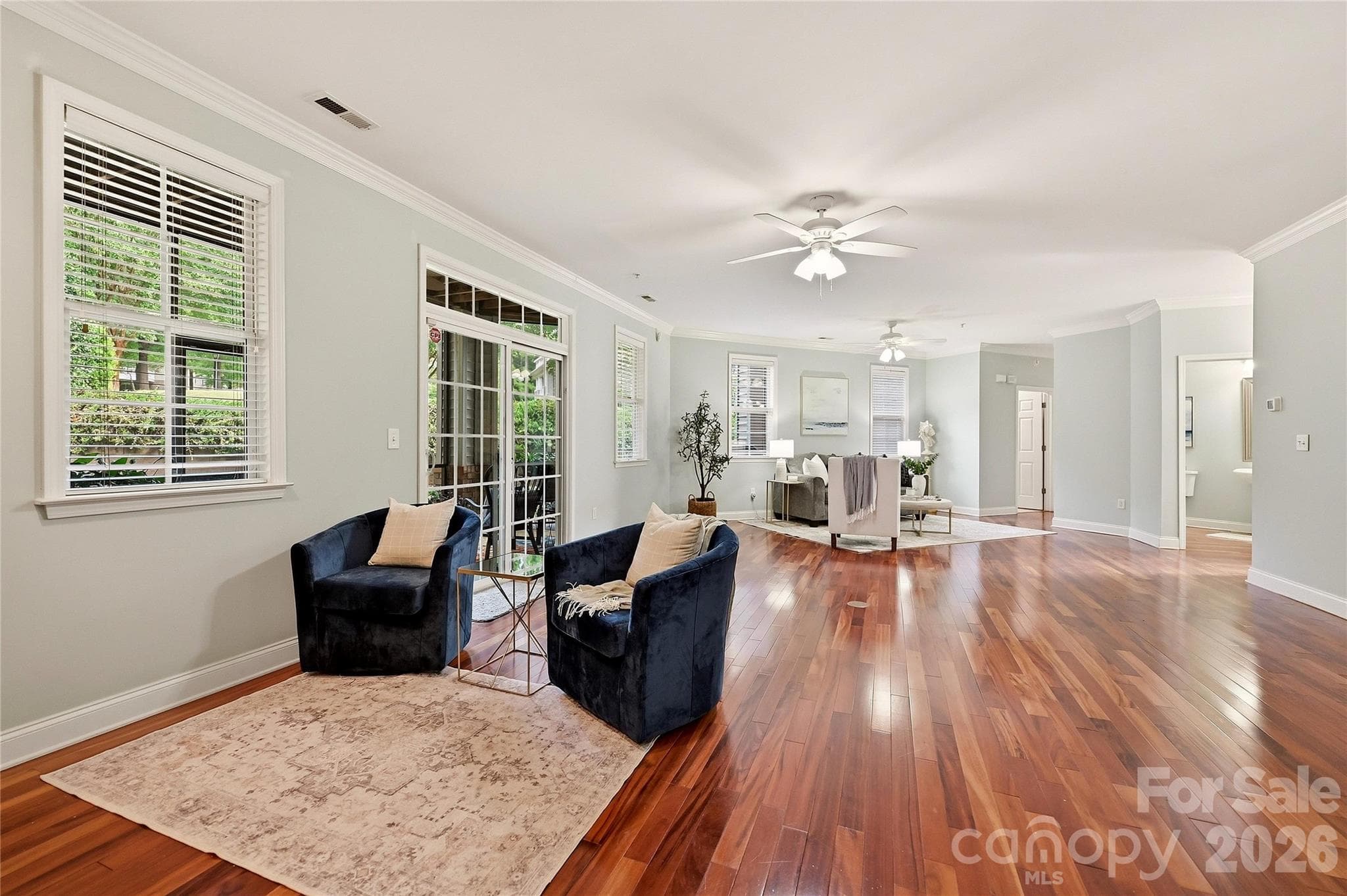 Expansive main living area highlights the condo's spacious one-level floor plan and beautiful hardwood flooring. - 9009 Rosalyn Glen Road, Cornelius