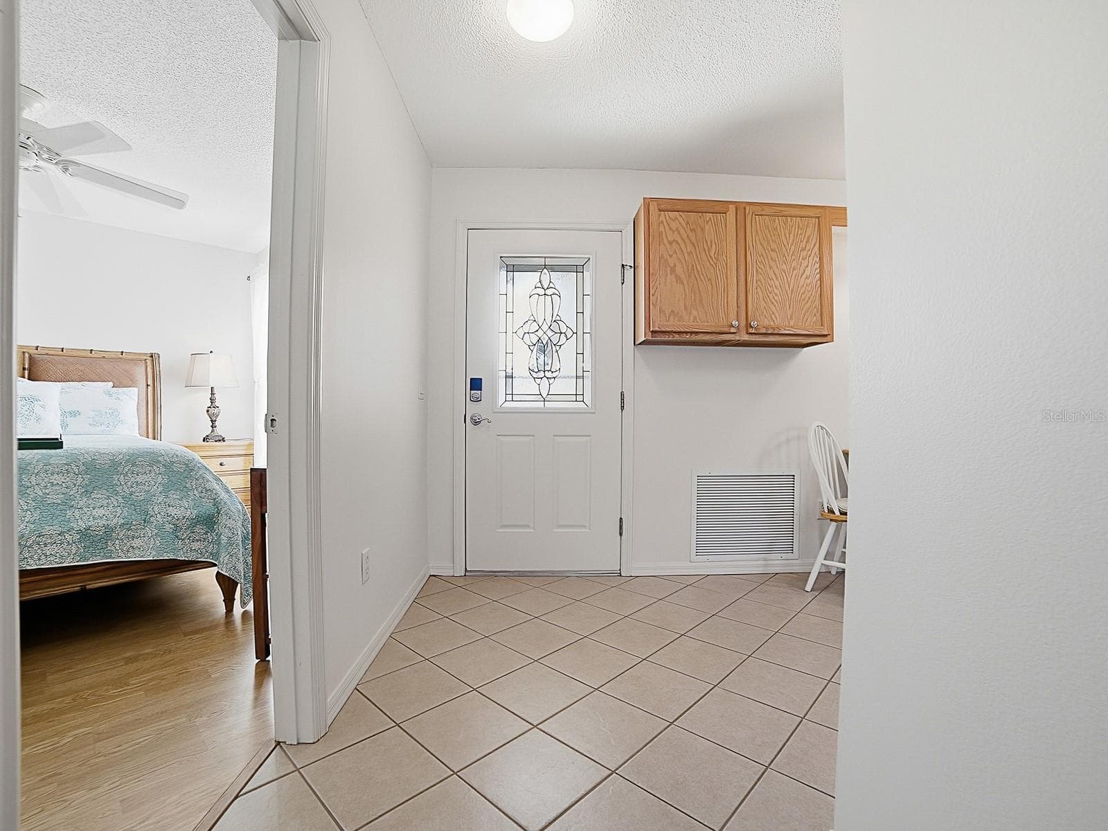 Leaded door offers lots of natural light - 484 AINTREE LN, THE VILLAGES