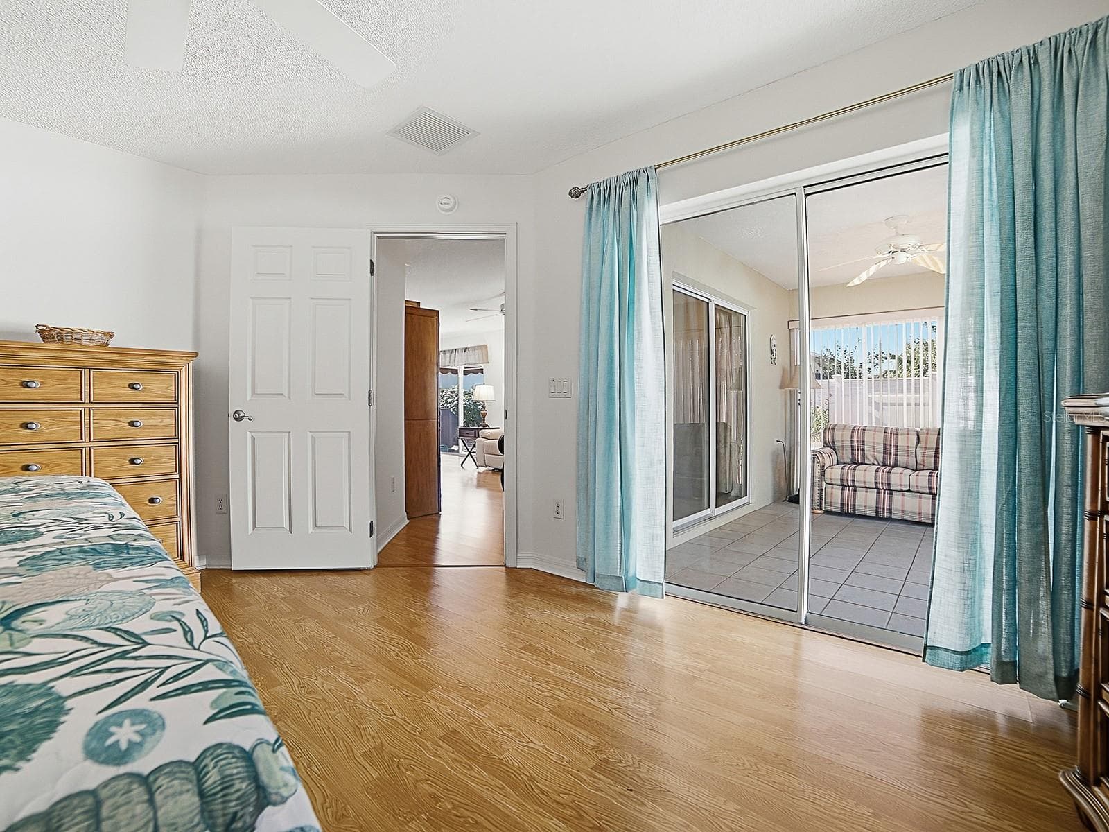 Another view to the sliders from the primary bedroom - 484 AINTREE LN, THE VILLAGES