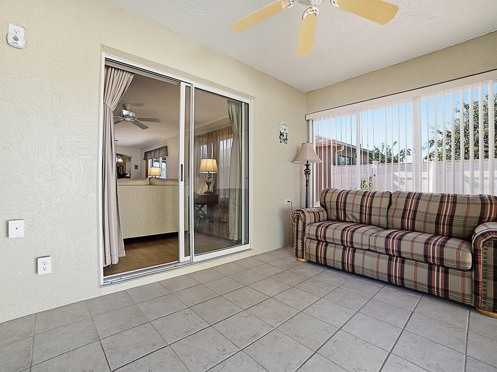 View of sliders in lanai - 484 AINTREE LN, THE VILLAGES