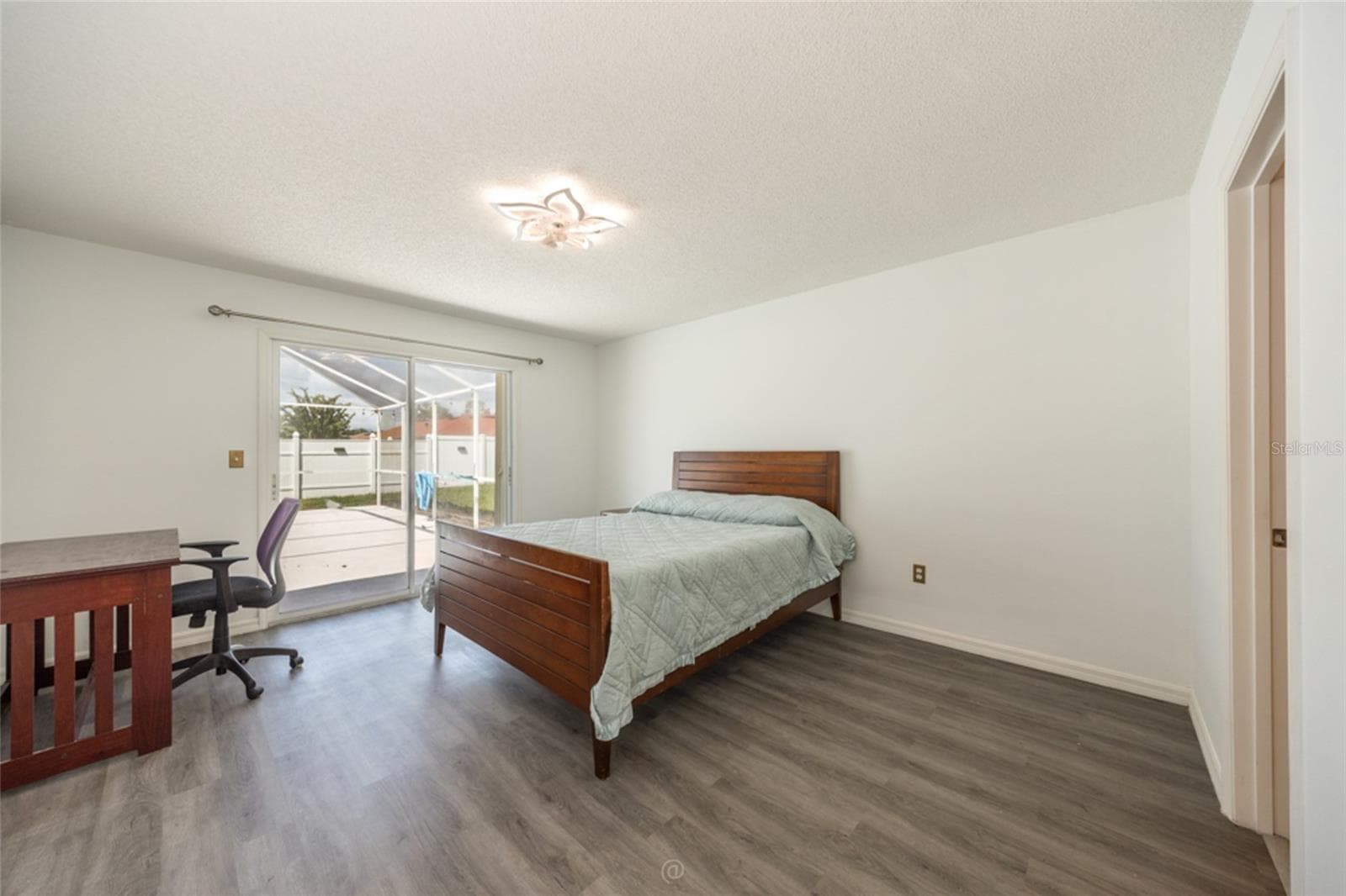 large primary suite with sliders to pool - 11 LANCASTER LN, PALM COAST