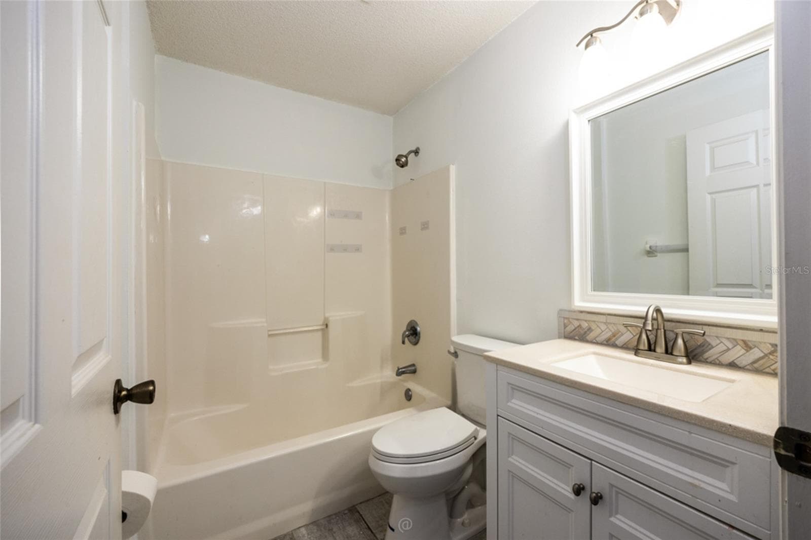 vanity and toilet updated in guest bathroom which is between bedroom #2 and bedroom #3 - 11 LANCASTER LN, PALM COAST