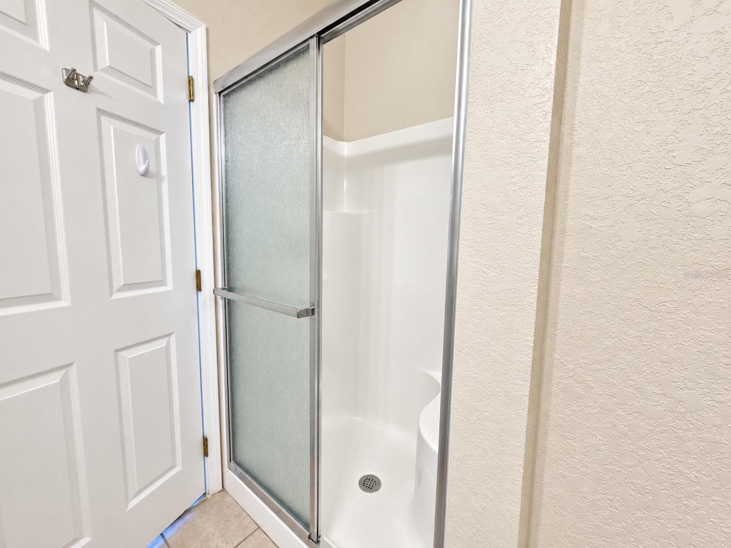 Primary Bathroom - walk-in shower with built in bench - 830 AIRPORT RD #111, PORT ORANGE