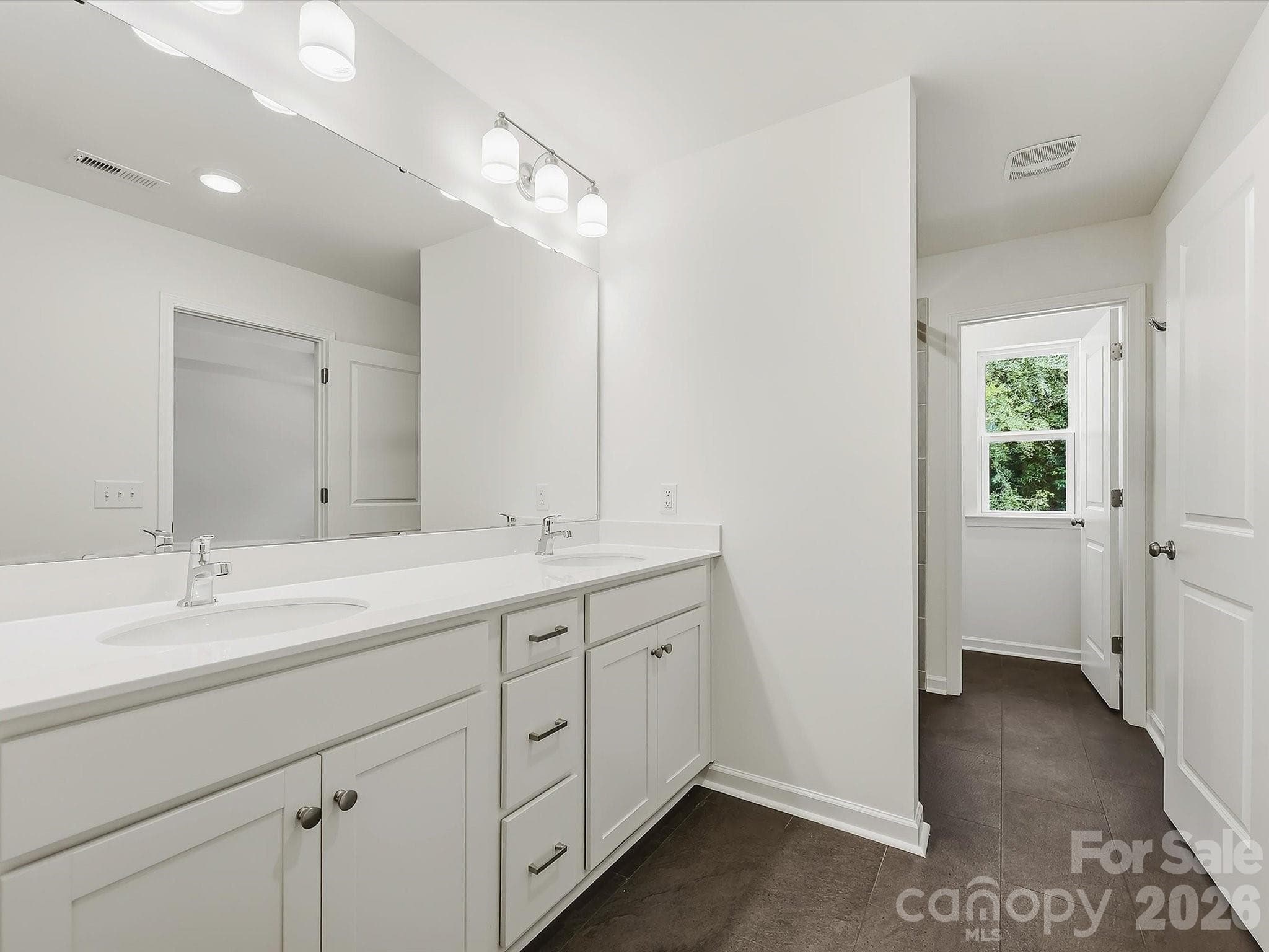 Owner's Bathroom Offering a Double Sink Vanity - 6613 Fire Lily Lane, Charlotte