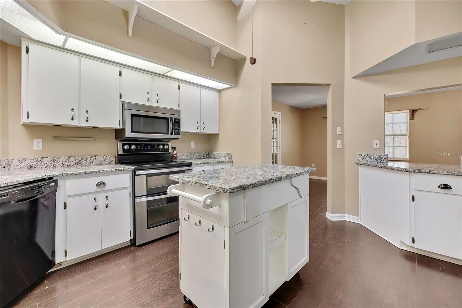 Kitchen with stainless-steel appliances and generous workspace - 1097 FLORIAN WAY, SPRING HILL