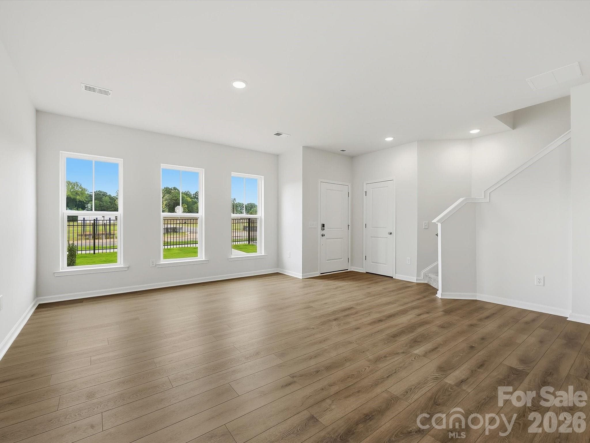 Spacious Living Room with an Abundance of Natural Light - 6609 Fire Lily Lane, Charlotte