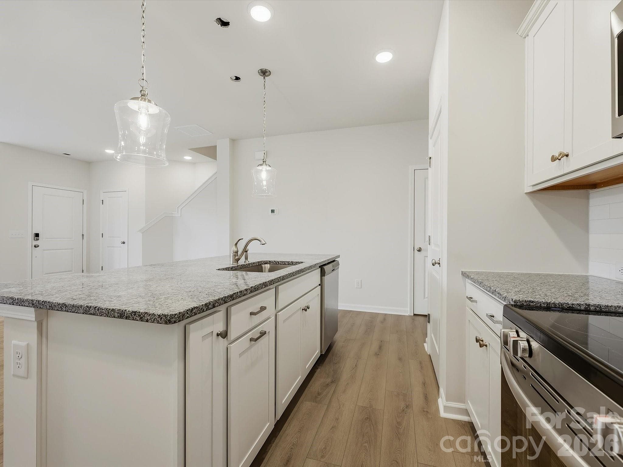 Large Island Centering the Kitchen - 6609 Fire Lily Lane, Charlotte