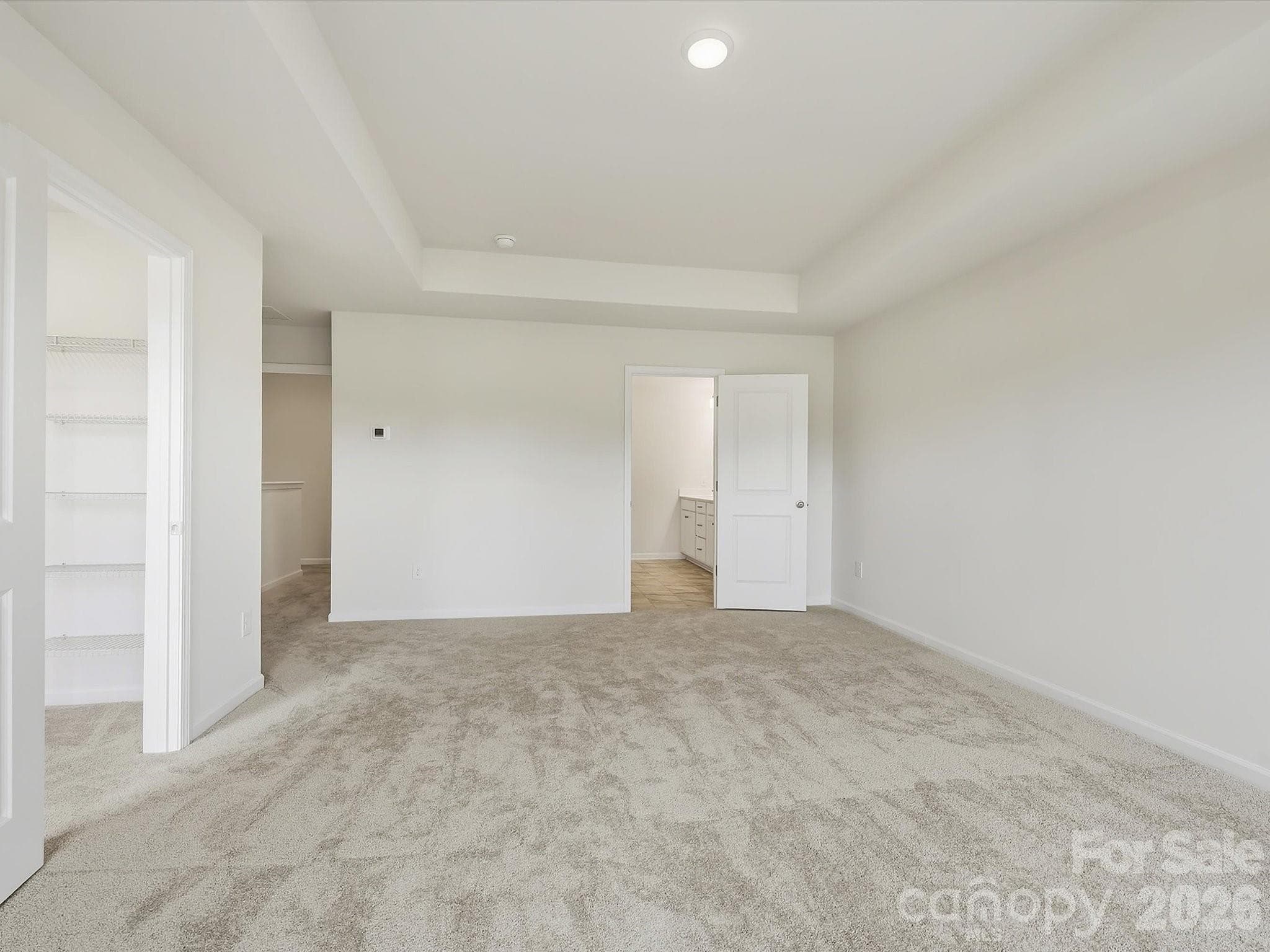 Spacious Owner's Suite with Entry to Large Owner's Closet off of Room and Separate Entrance to Owner's Bathroom from Room - 6609 Fire Lily Lane, Charlotte