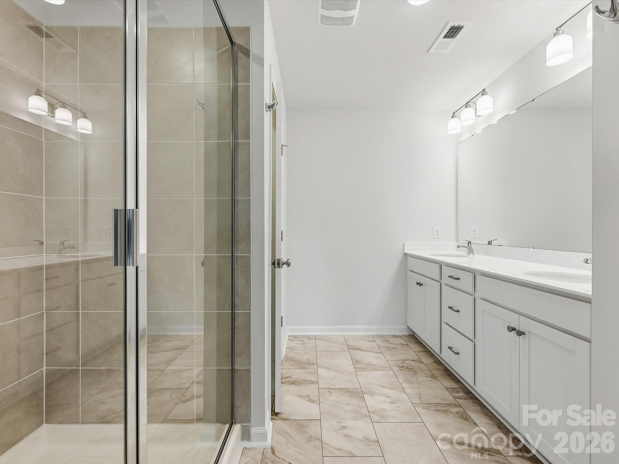 Owner's Bathroom Offering a Large Shower and Double Vanity - 6609 Fire Lily Lane, Charlotte