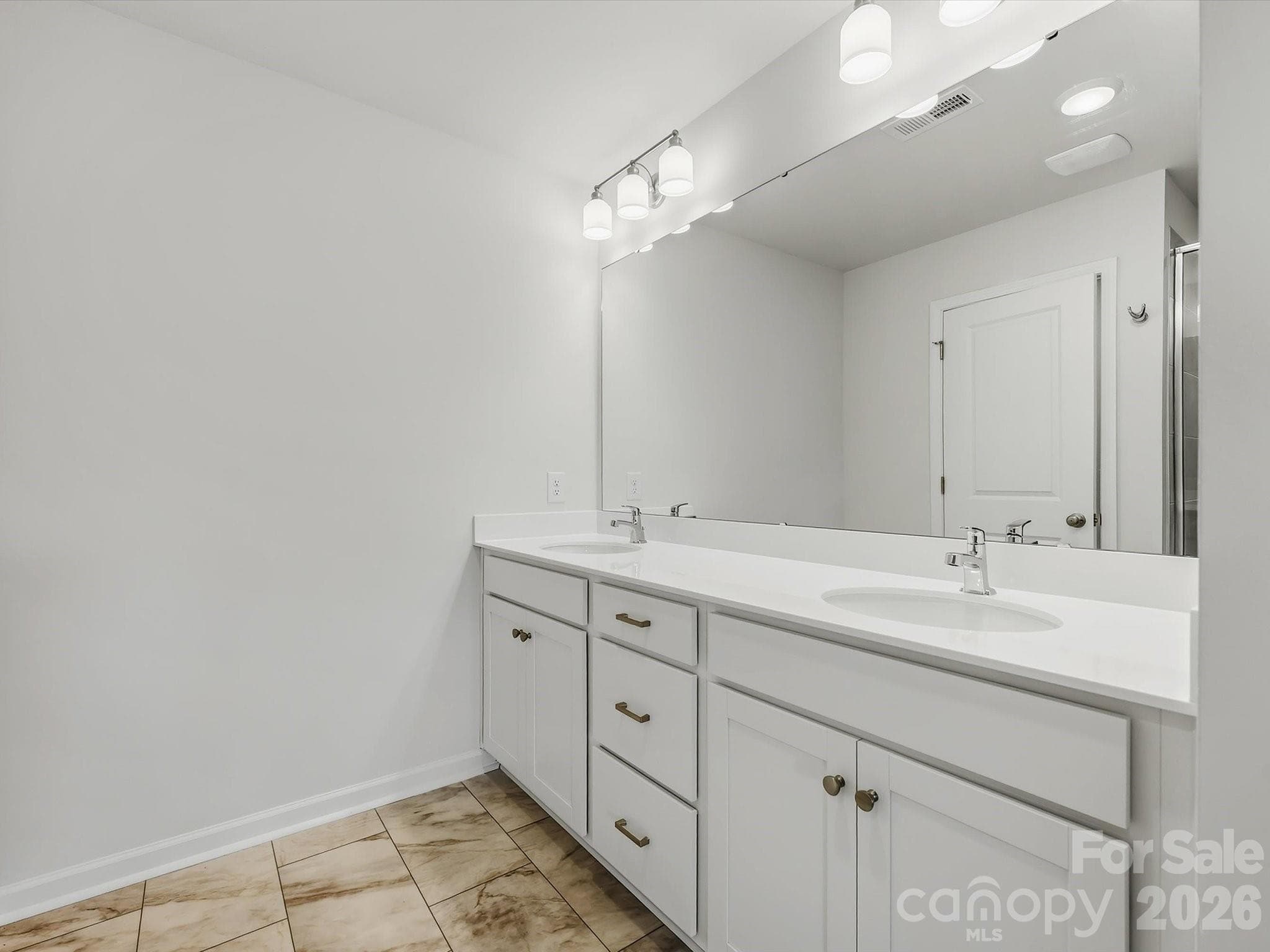 Owner's Bathroom Offering a Double Vanity - 6609 Fire Lily Lane, Charlotte