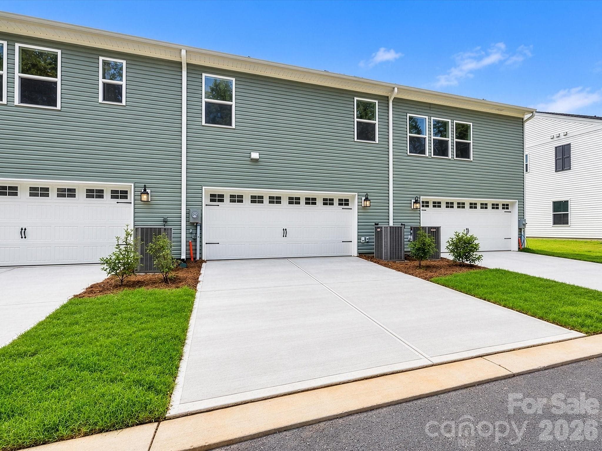 Rear 2 car side-by-side Garage and a 20 ft Driveway for 4 Parking Spots - 6609 Fire Lily Lane, Charlotte