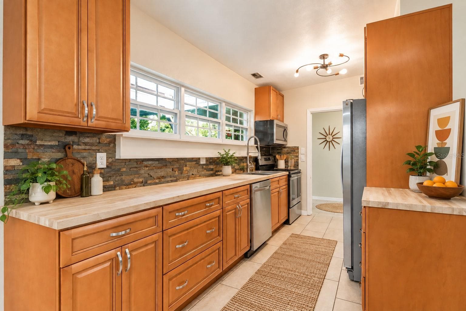 AI altered pictures with staged rooms for Buyer ease of visualization - 416 BROXBURN AVE, TEMPLE TERRACE