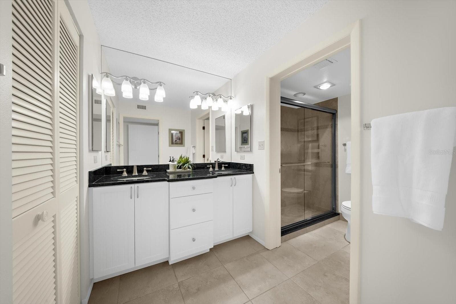Primary Bathroom with Dual Sinks and Walk-In Shower - 843 BAYPORT WAY #843, LONGBOAT KEY