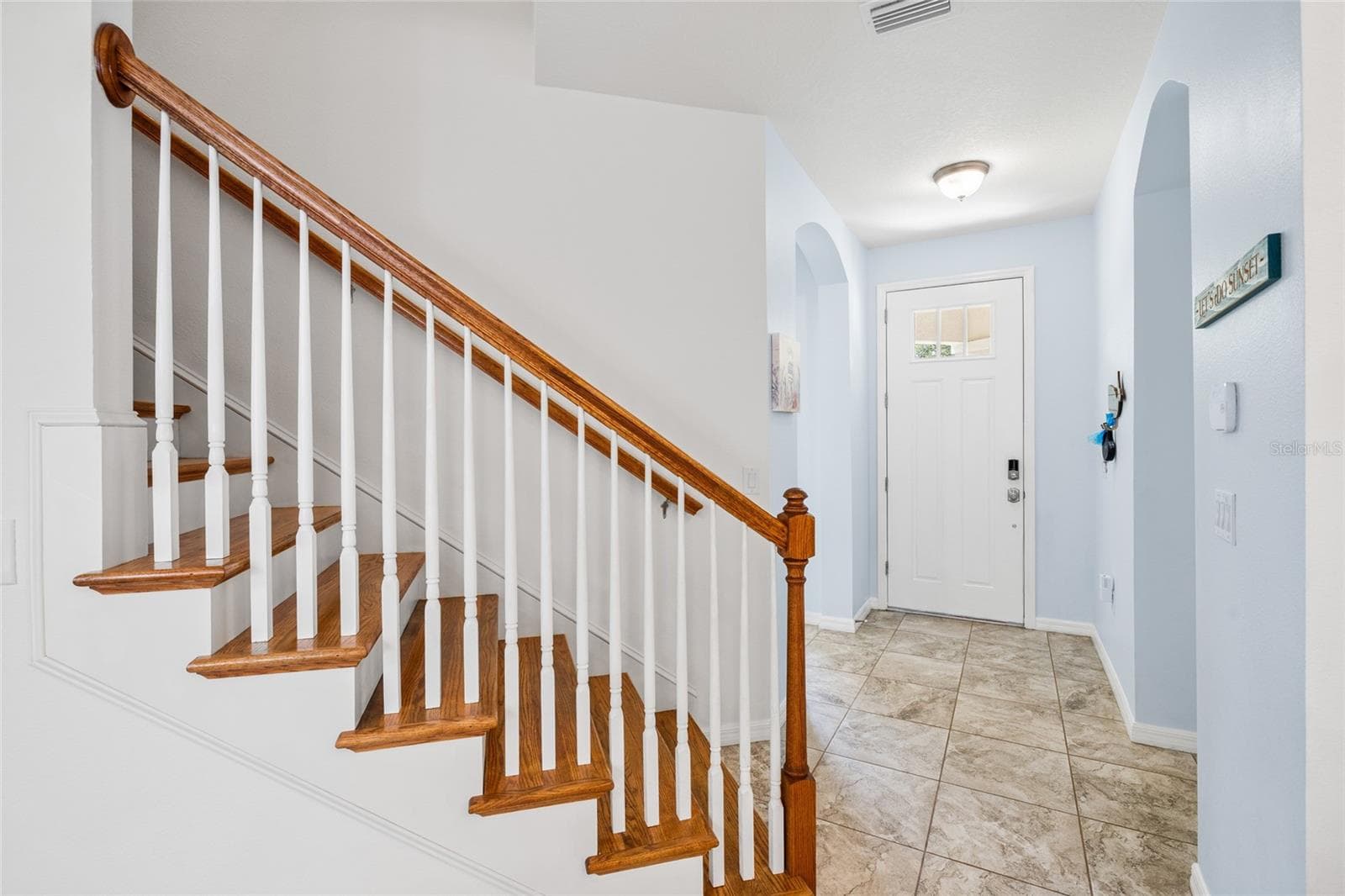 stairs looking to front door - 8519 ARABELLA LN, SEMINOLE