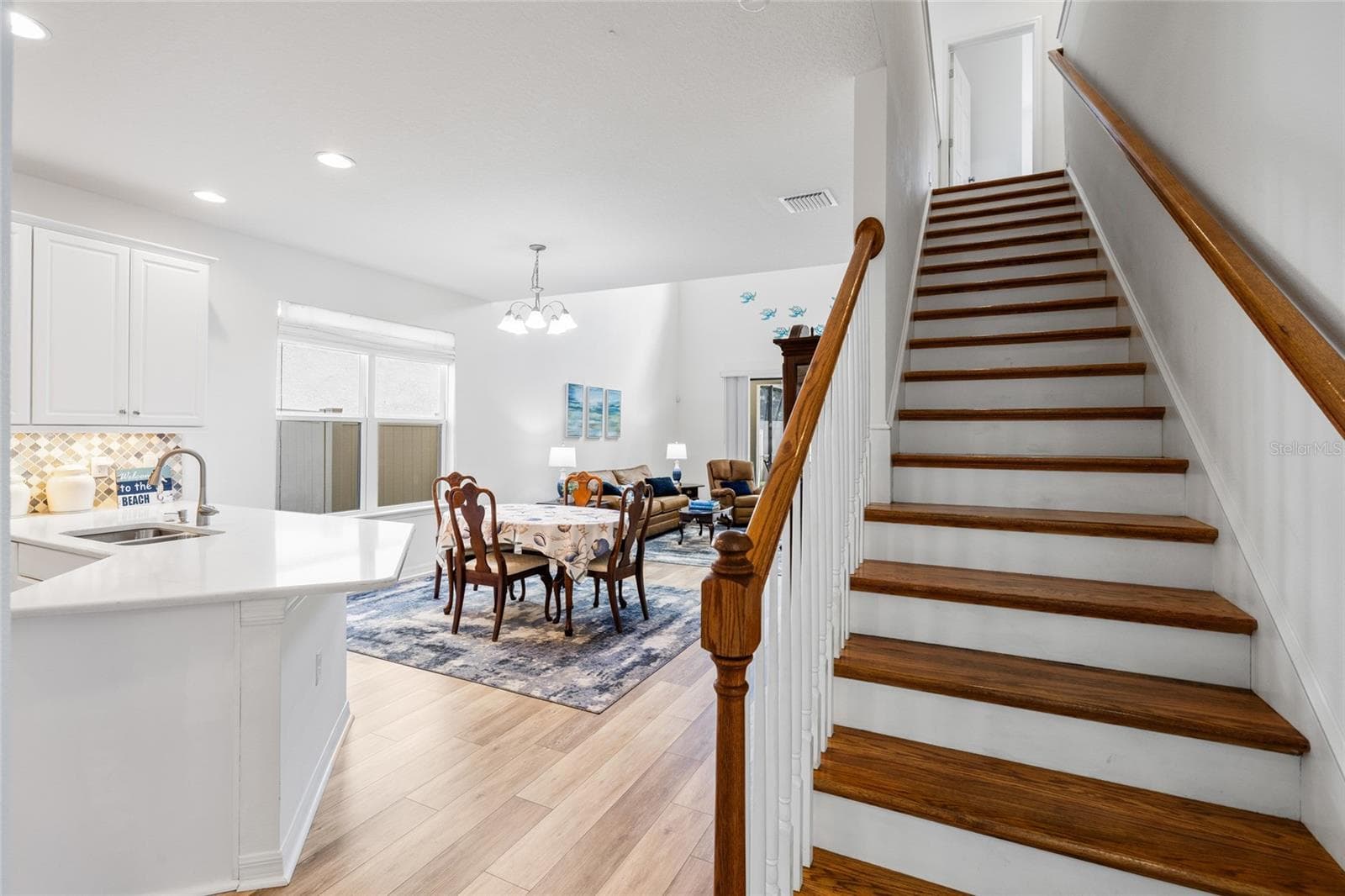 View of stairs, into kitchen, dining area and great room. - 8519 ARABELLA LN, SEMINOLE