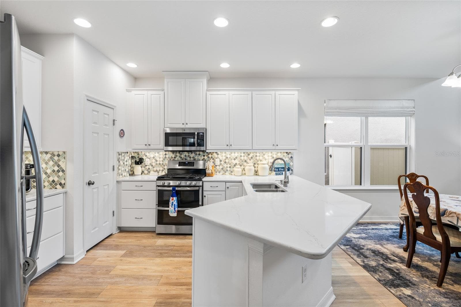 Kitchn area with walk in pantry - 8519 ARABELLA LN, SEMINOLE