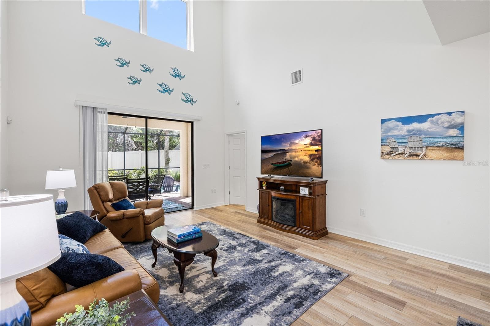 Great room looking toward pool and primary suite - 8519 ARABELLA LN, SEMINOLE