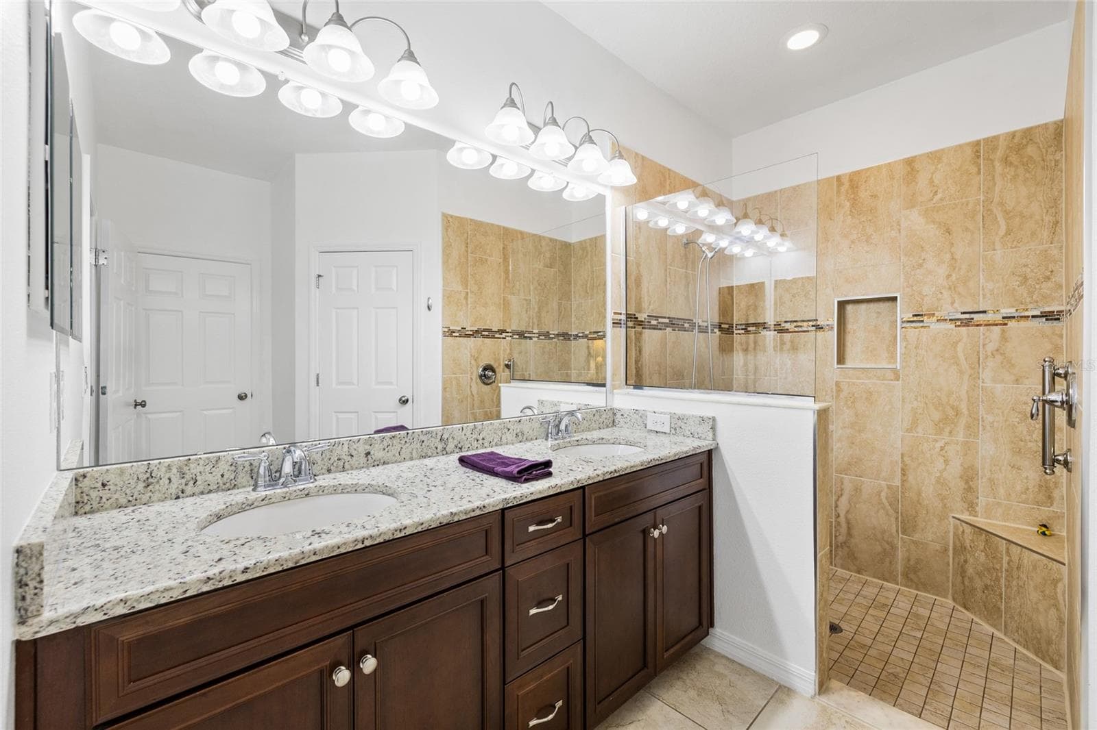 Primary bathroom - tall counters, double sink, wlak in shower, walk in closet and private commode room. - 8519 ARABELLA LN, SEMINOLE