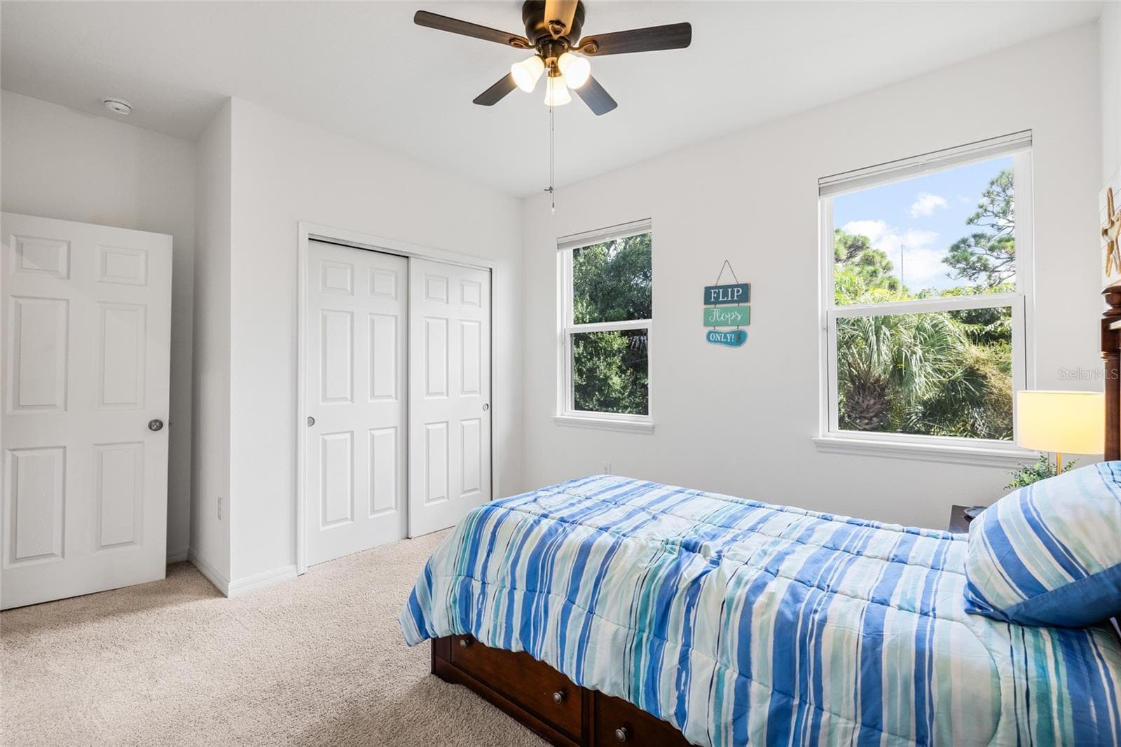 Bedroom 2 - looking toward closet and from the ensuite bath. - 8519 ARABELLA LN, SEMINOLE
