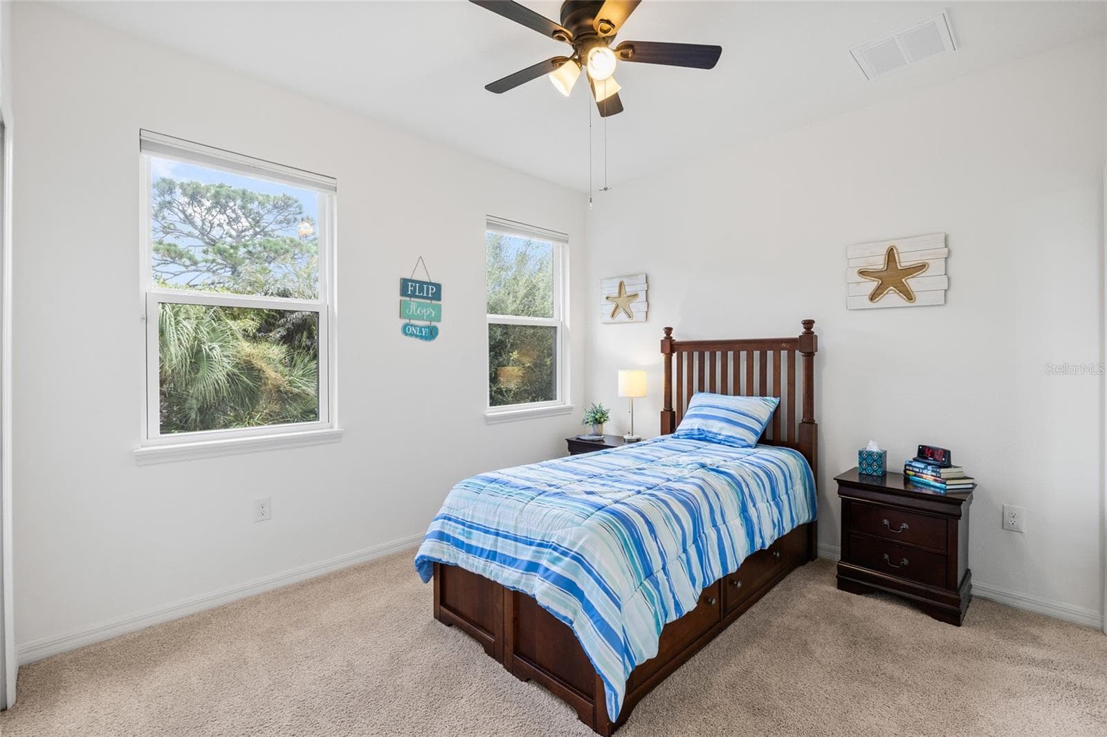Bedroom 2 with private ensuite bath. - 8519 ARABELLA LN, SEMINOLE