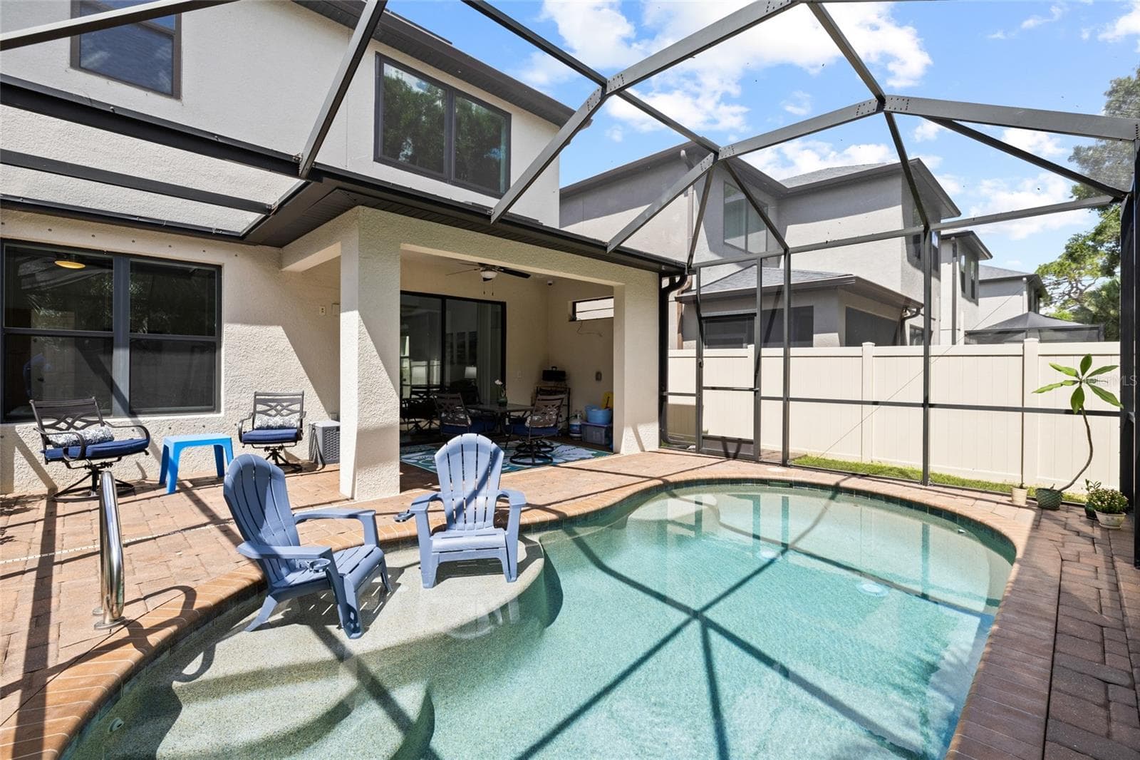 Pool area looking toward house. - 8519 ARABELLA LN, SEMINOLE