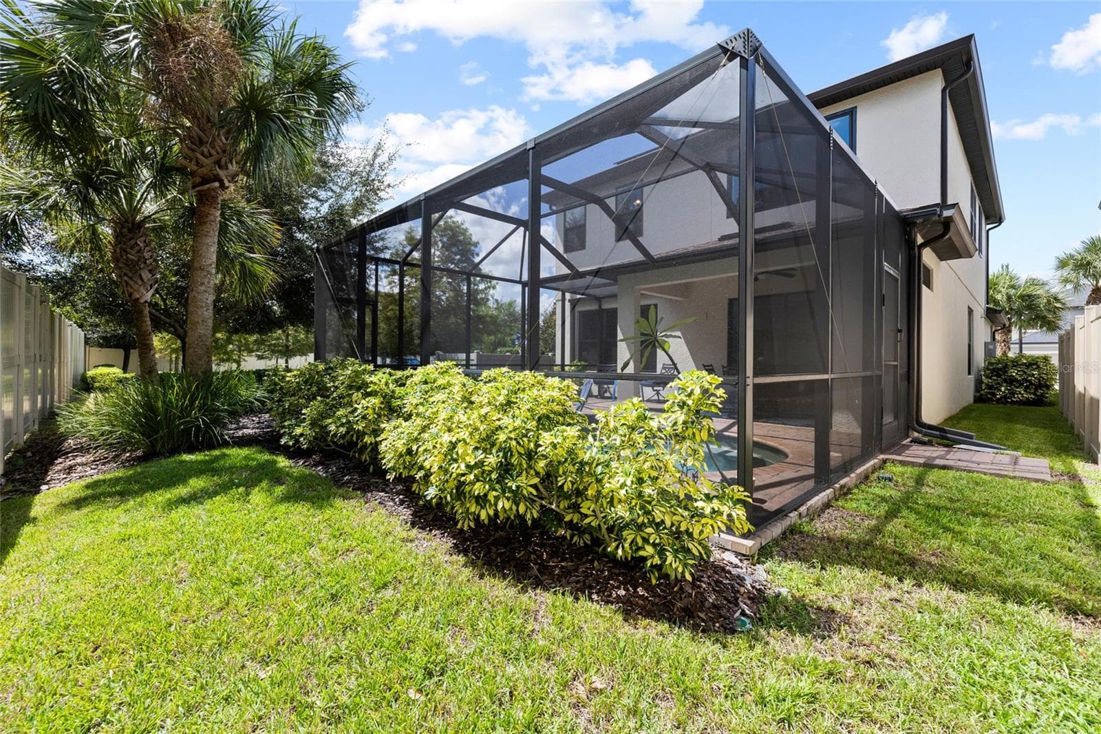 Rear and side yard looking toward house. - 8519 ARABELLA LN, SEMINOLE