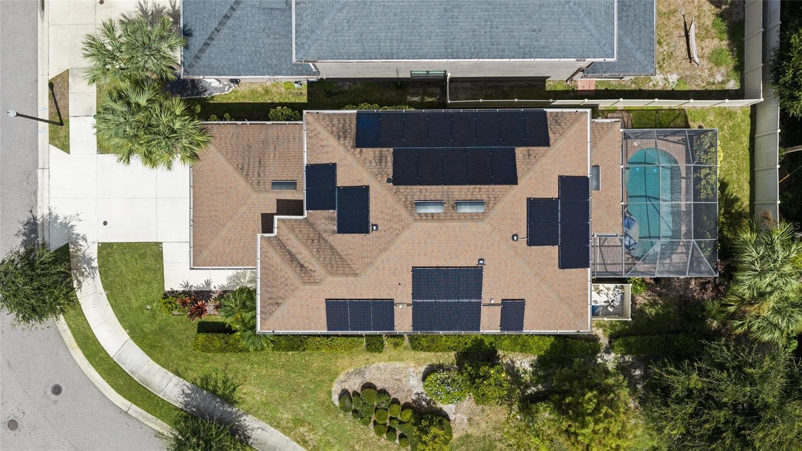 Aerial view - all solar panels are owned. Open space to the side of the house - so only one neighbor. - 8519 ARABELLA LN, SEMINOLE