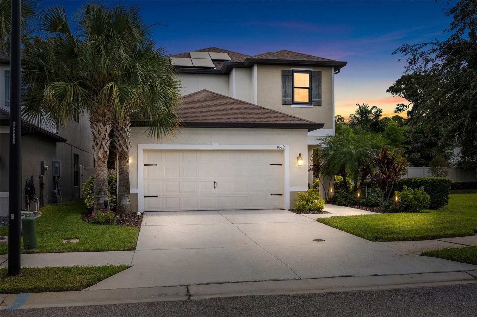 Exterior of home at twilight - 8519 ARABELLA LN, SEMINOLE
