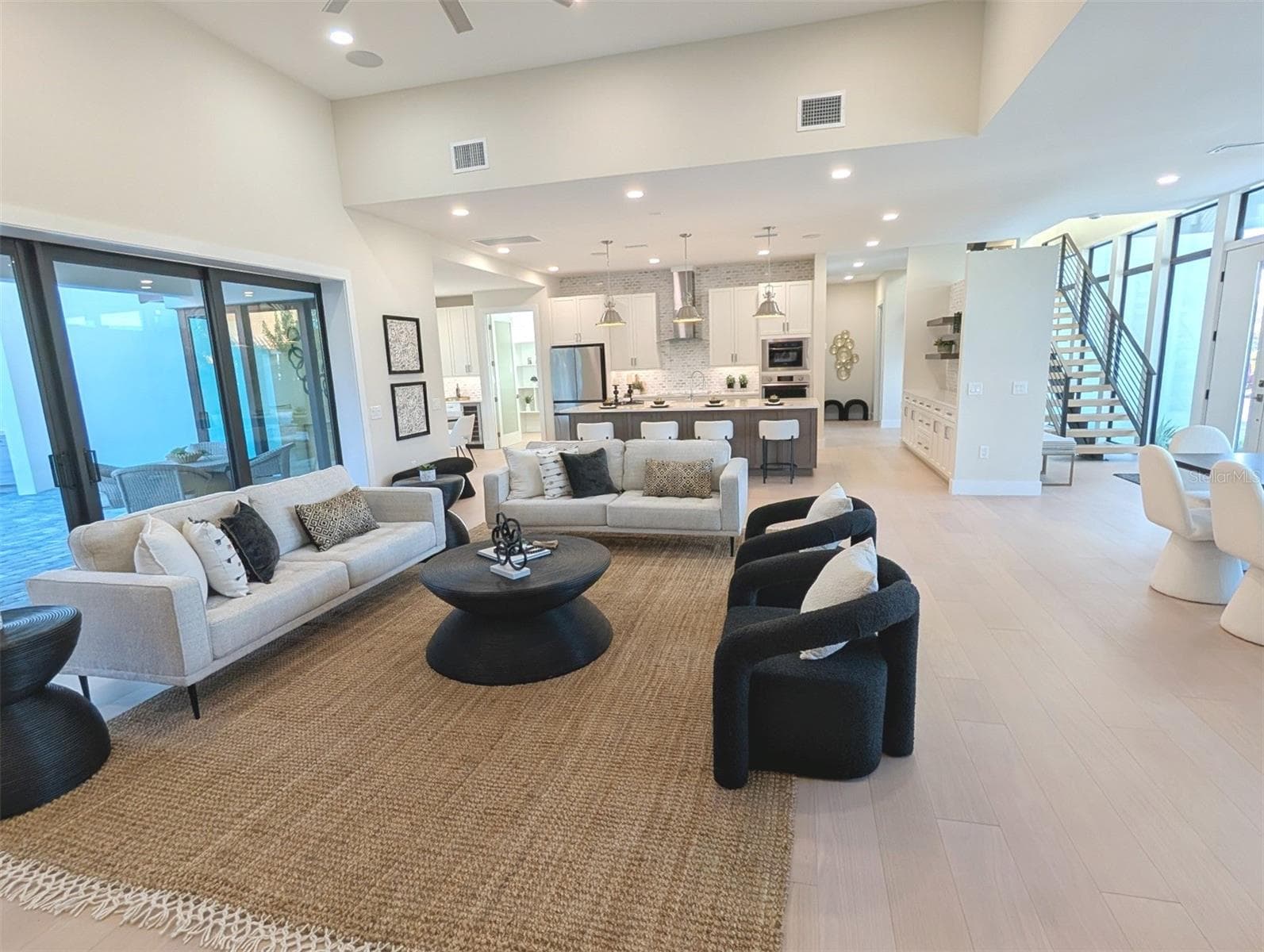 Great room with 13 foot ceiling, surround sound speakers, cat 6 wiring throughout, walls, ceiling sound insulated. - 2110 MICHELE DR, SARASOTA