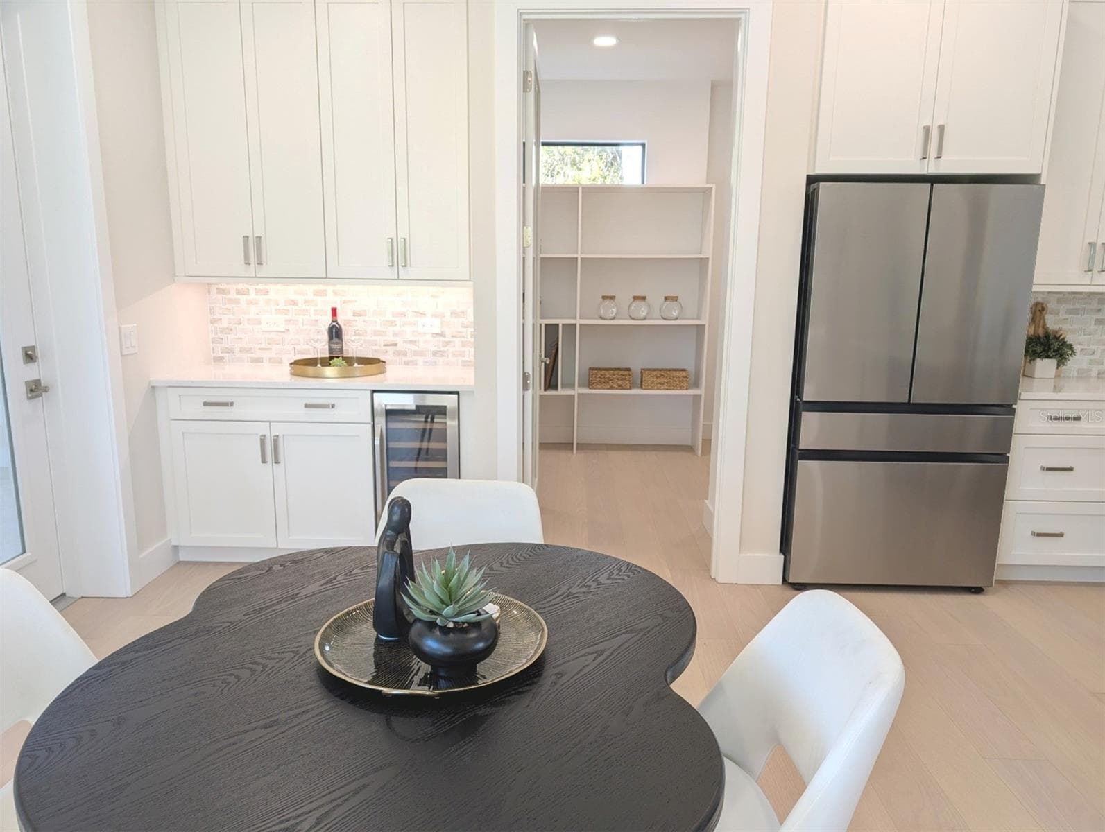 Coffee bar; spacious walk in pantry; under cabinet lighting; beverage cooler. - 2110 MICHELE DR, SARASOTA