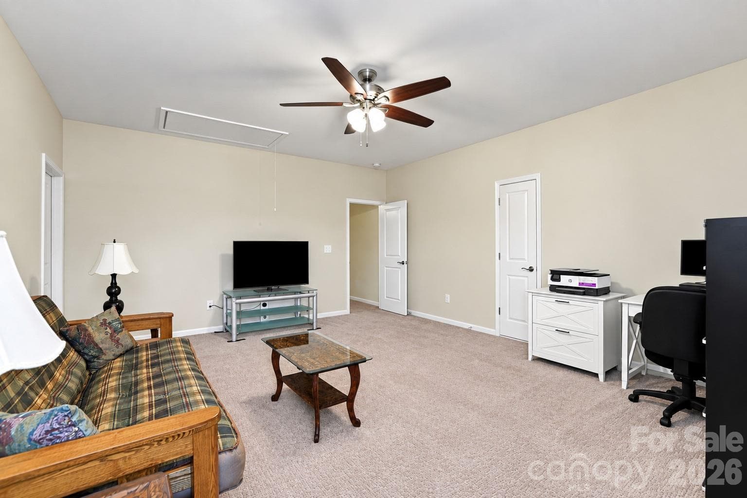 Second of two spacious bedrooms on the home's upper floor, currently used as a home office/tv room. - 8504 Hope Run Court, Indian Land