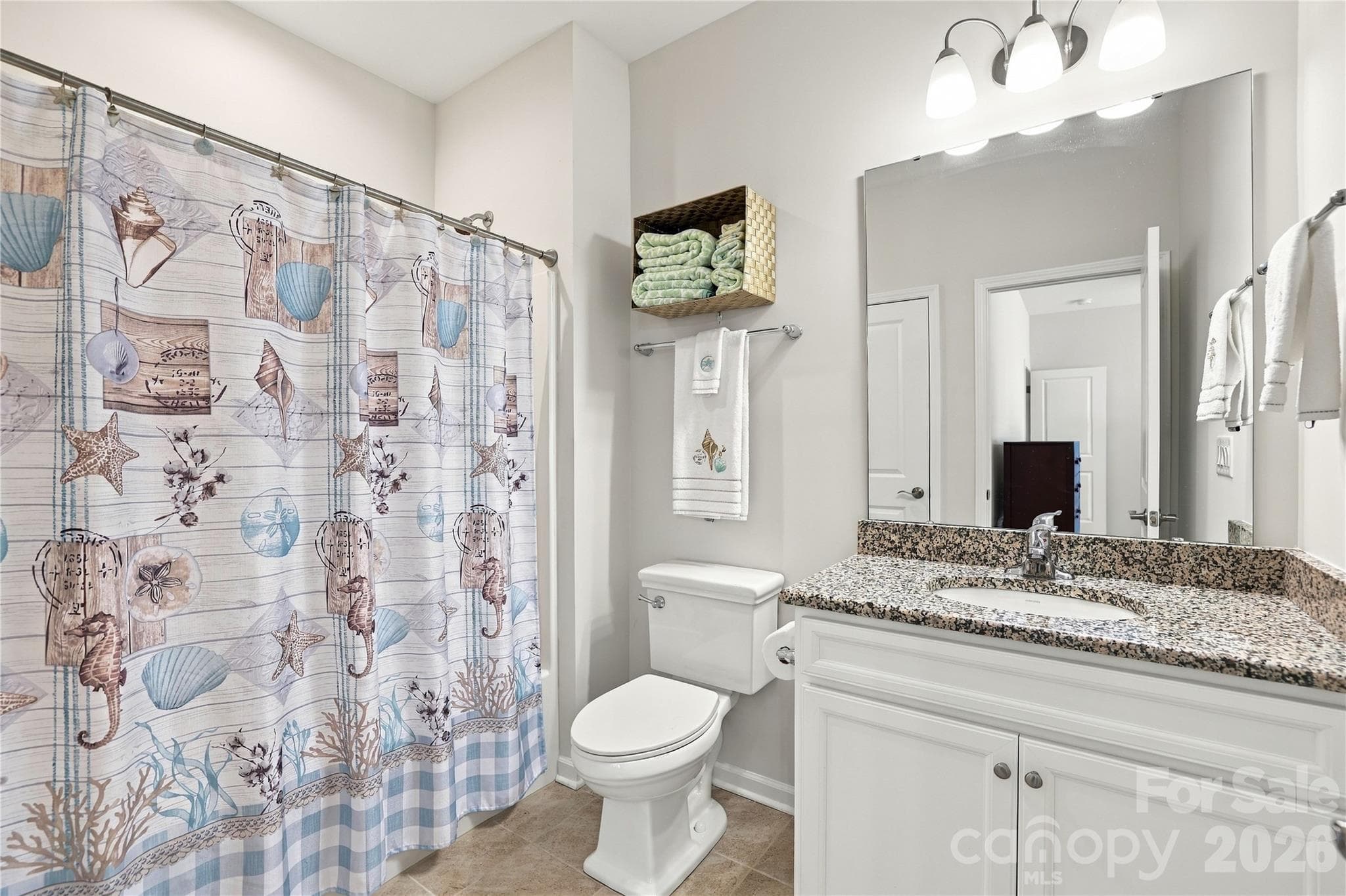 Second floor bathroom serving the two bedrooms on the upper level. Granite vanity counter, tub/shower, tile flooring. - 8504 Hope Run Court, Indian Land