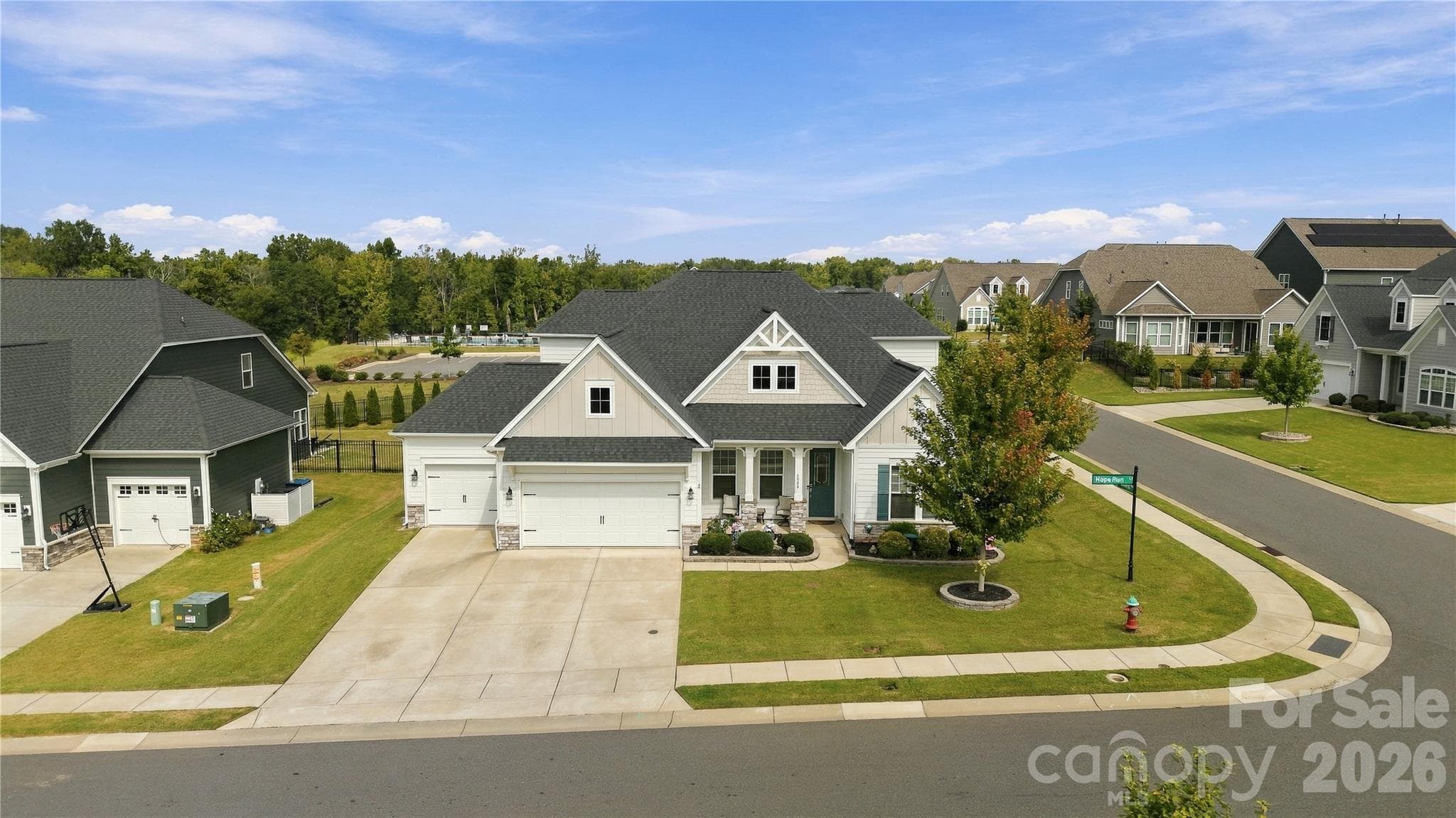 3-car garage with epoxy flooring and expansive driveway provide excellent parking and storage space. Welcome home! - 8504 Hope Run Court, Indian Land