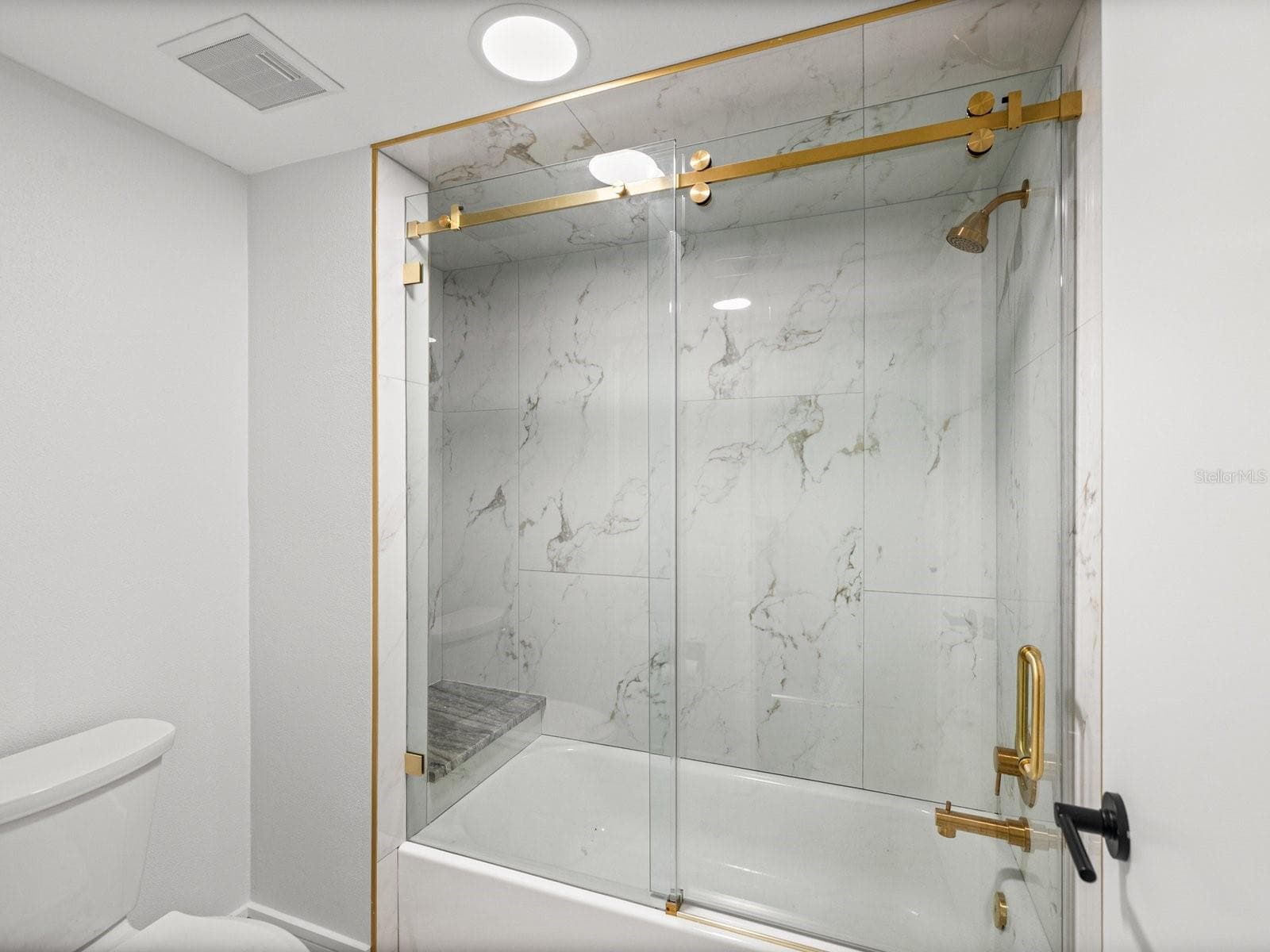 NEW primary tub shower with New enclosure and fixtures - 3076 EASTLAND BLVD #203, CLEARWATER