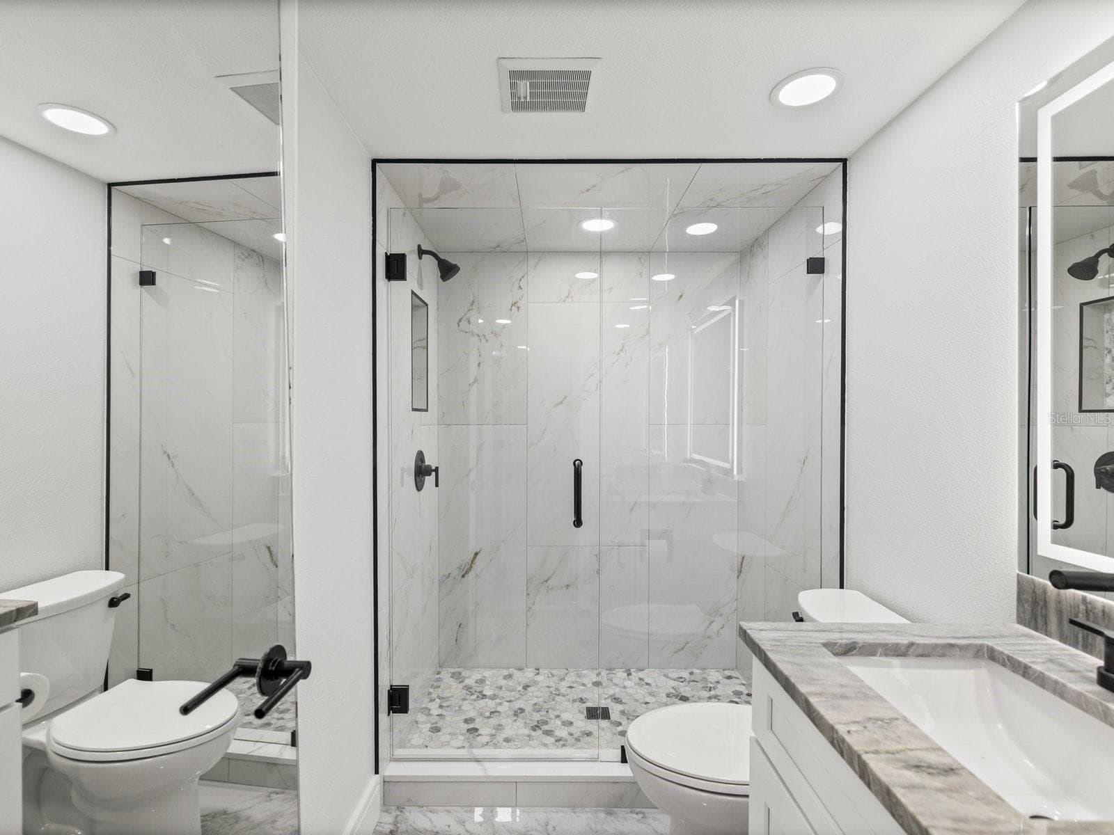 Guest bath with gorgeous step in tiled shower and beautiful glass enclosure - 3076 EASTLAND BLVD #203, CLEARWATER