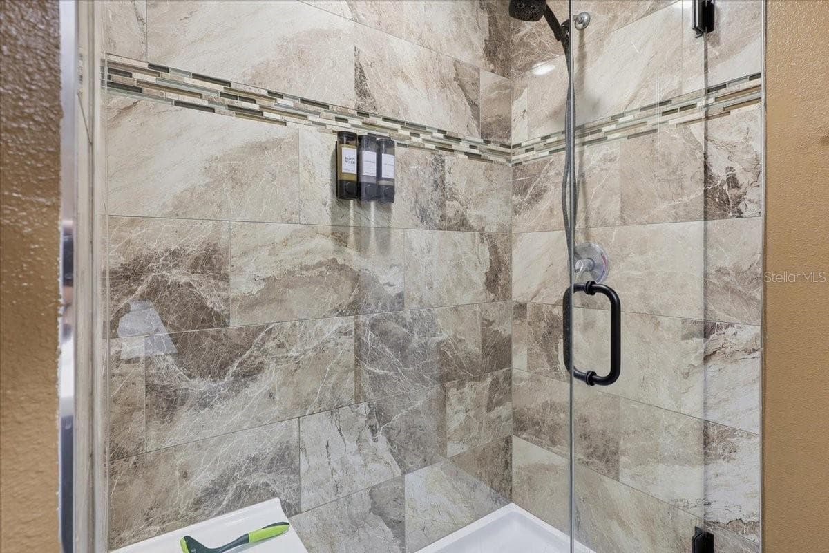 Beautiful Floor to Ceiling Tiled Shower - 7 UNIVERSAL TRL, PALM COAST