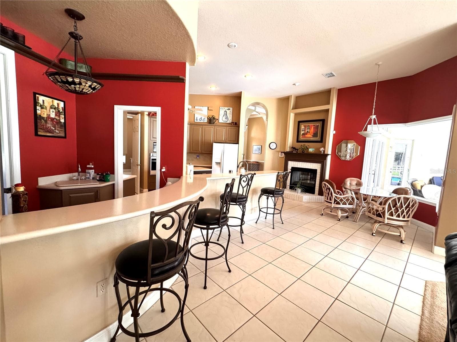 Open kitchen and casual dining area with plenty of room to gather. - 6722 W SENTINEL BLUFF PATH, BEVERLY HILLS