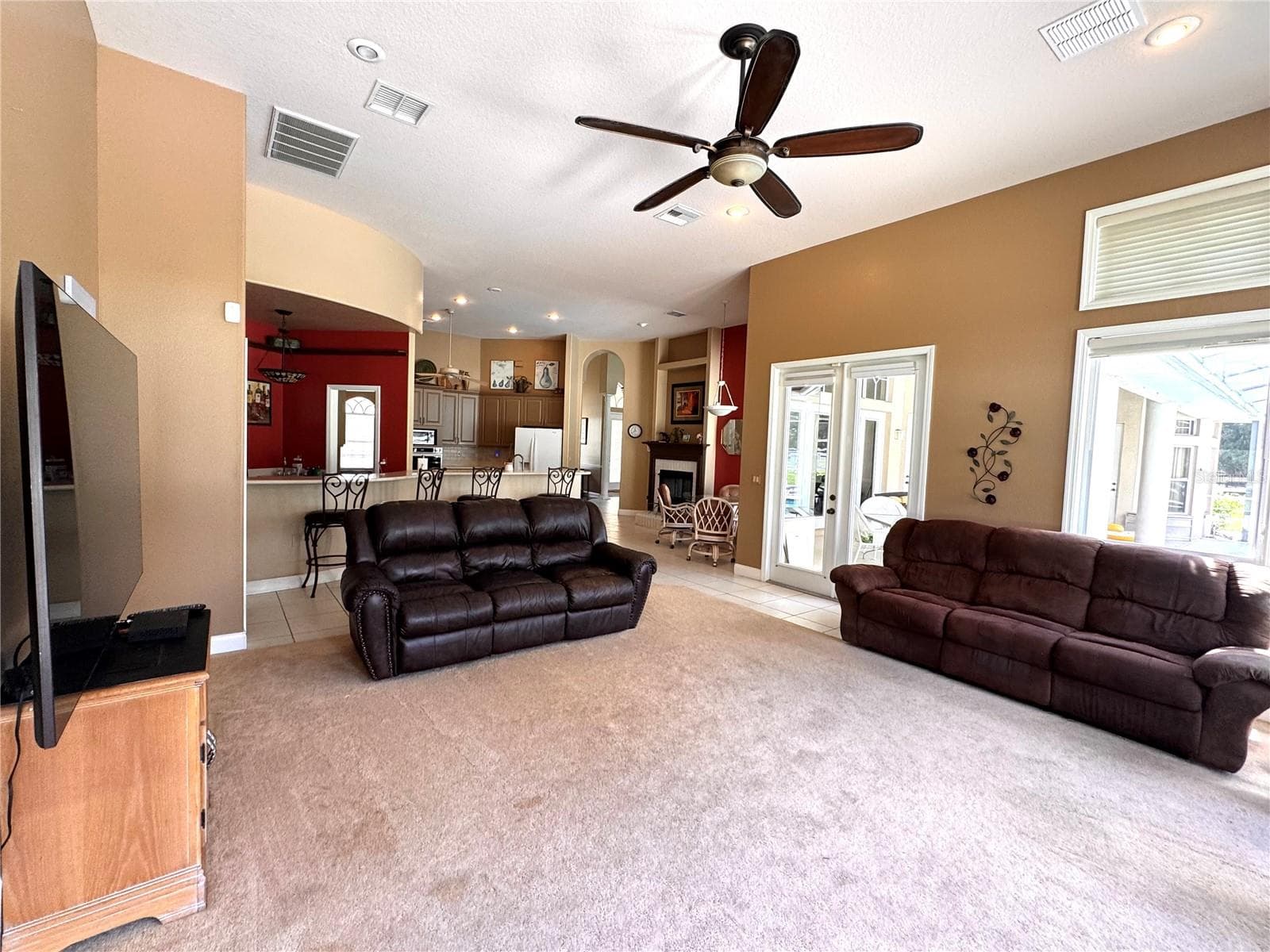 Spacious family room with abundant light and room to gather. - 6722 W SENTINEL BLUFF PATH, BEVERLY HILLS