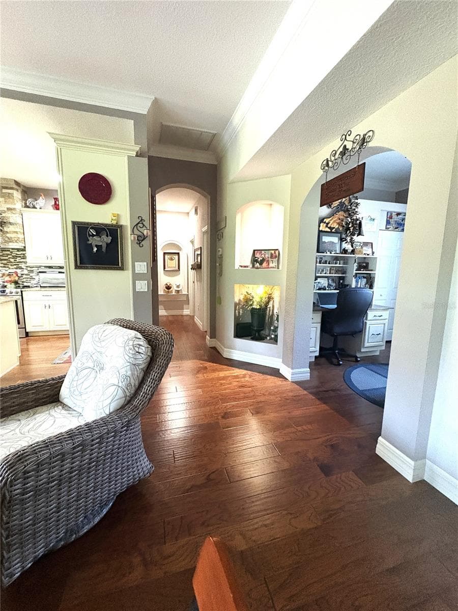 looking out from primary bedroom door toward office and additional bedrooms - 19588 SW 86TH LN, DUNNELLON