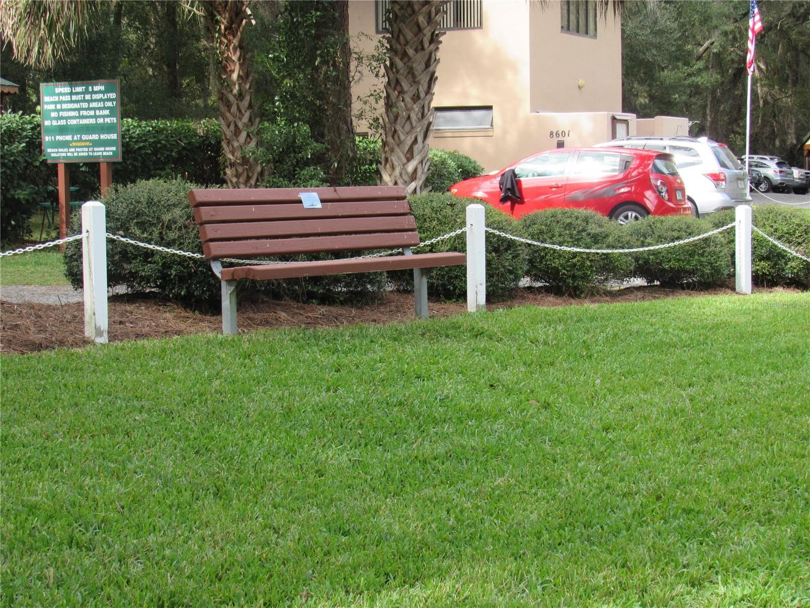 memory bench in grassy area overlooking swim area at River Park - 19588 SW 86TH LN, DUNNELLON