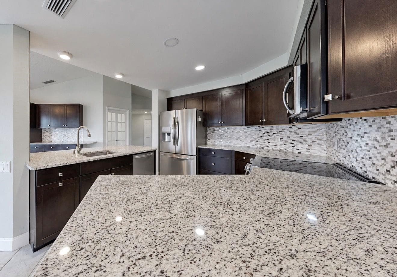 Kitchen from Living Room - 4115 MURFIELD DR E, BRADENTON