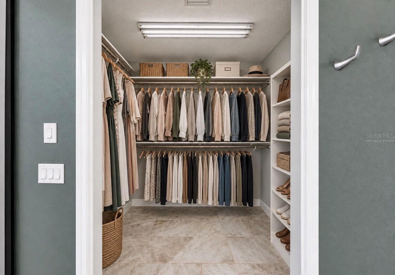 Virtually staged- Walk In Closet in Primary Suite - 4115 MURFIELD DR E, BRADENTON