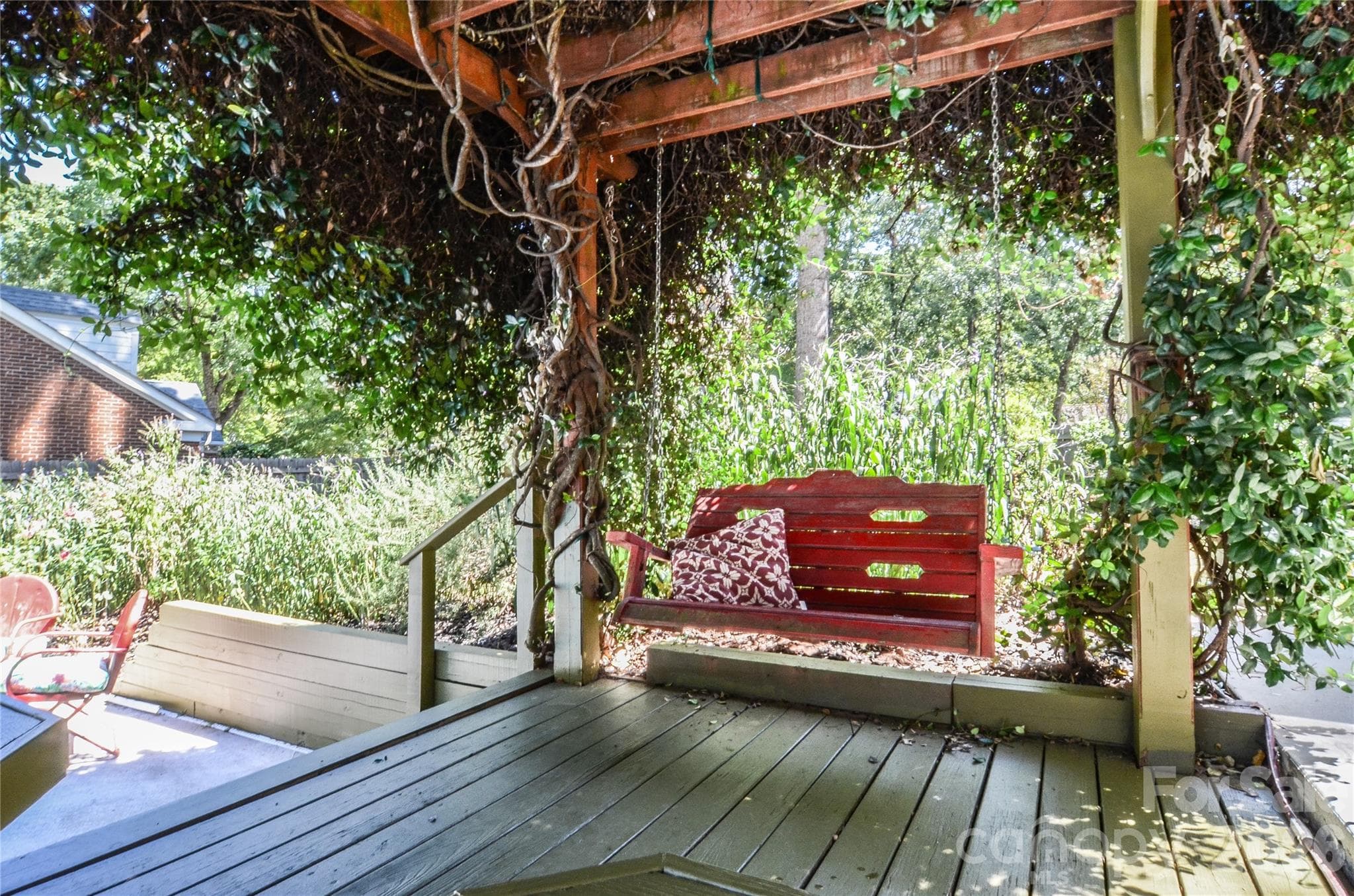 Swing under Jasmine-Covered Pergola - 500 Laurel Fork Drive, Matthews