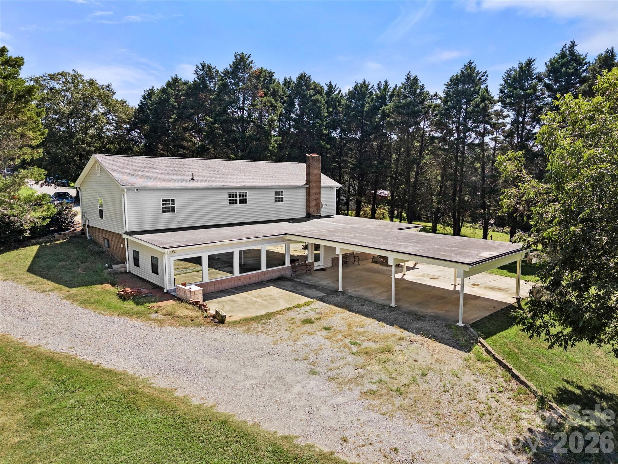 Private driveway to 2nd living quarters, a 3 space car port offering additional space for a grilling and patio area - 109 Woodside Avenue, Gastonia