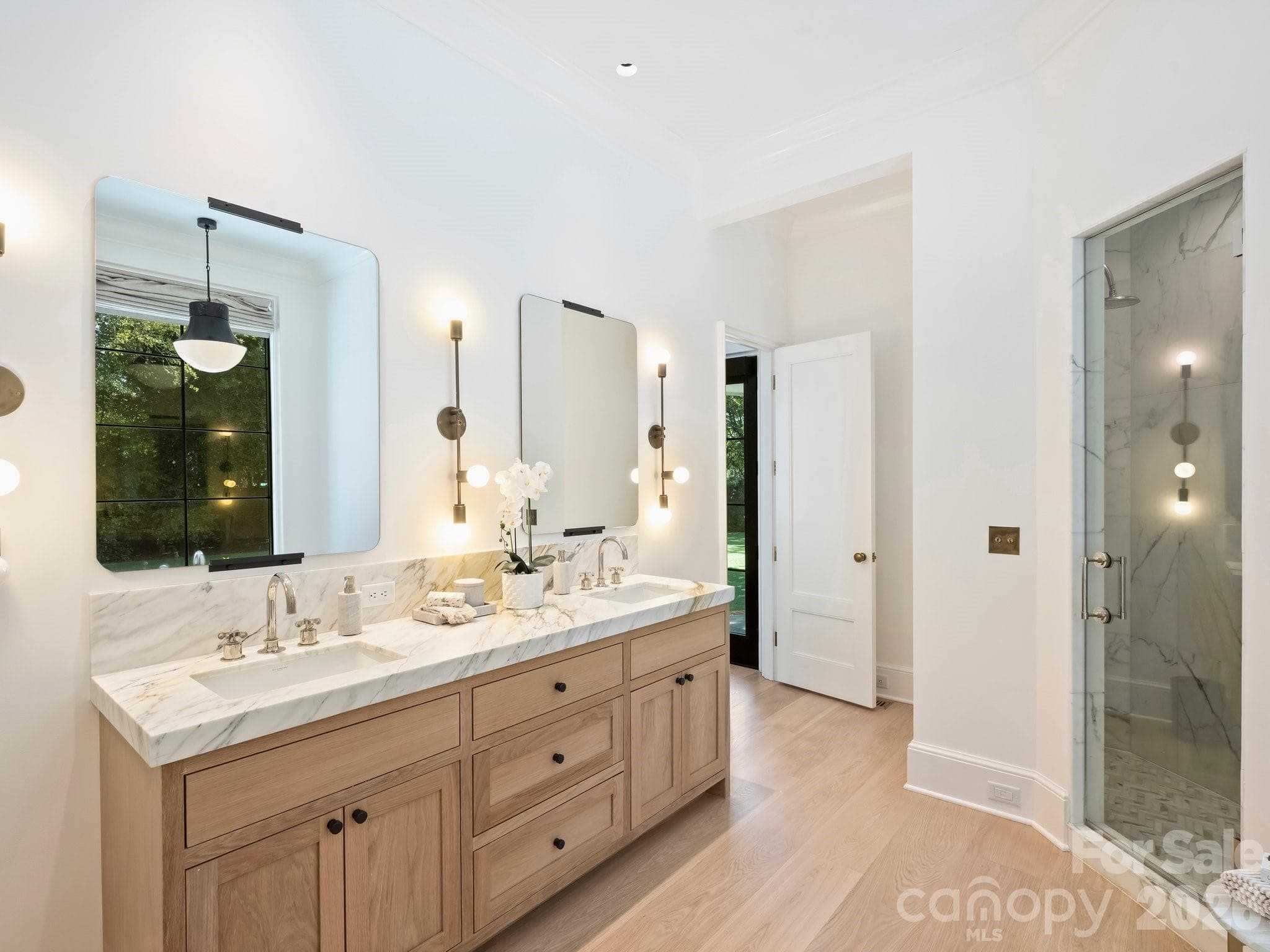 Primary Suite bath with the same beautiful Panoazzo marble counters, Waterworks fixtures, deep marble shower and private soaking tub - 600 Hermitage Road, Charlotte