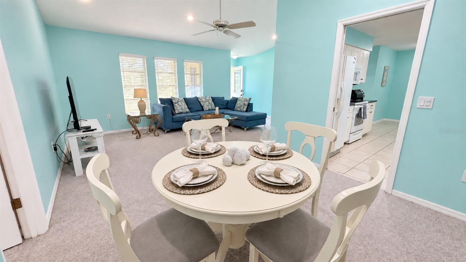 A dining area off of the kitchen and living room. - 285 MARK TWAIN LN, ROTONDA WEST