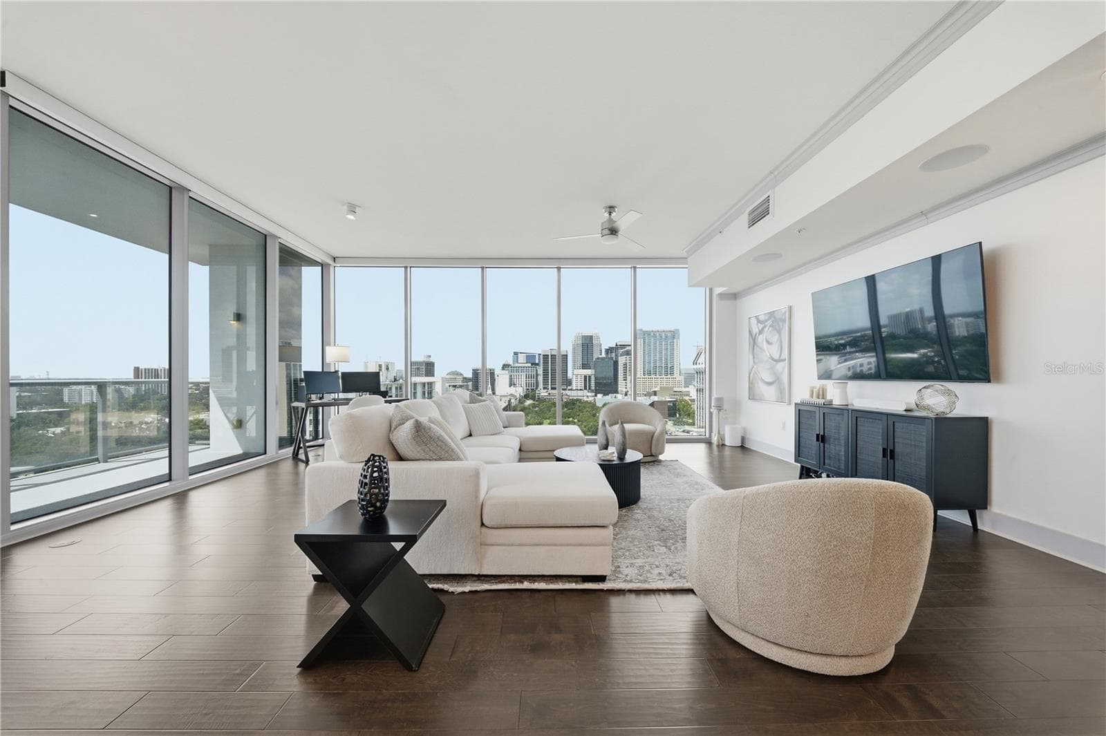 City view from kitchen overlooking living space. Dynamic layering of DTO buildings. - 260 S OSCEOLA AVE #1406, ORLANDO
