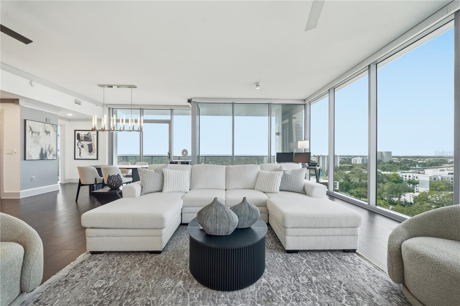 Living Room | Downtown Orlando’s layered skyline becomes the backdrop to the main living space - 260 S OSCEOLA AVE #1406, ORLANDO