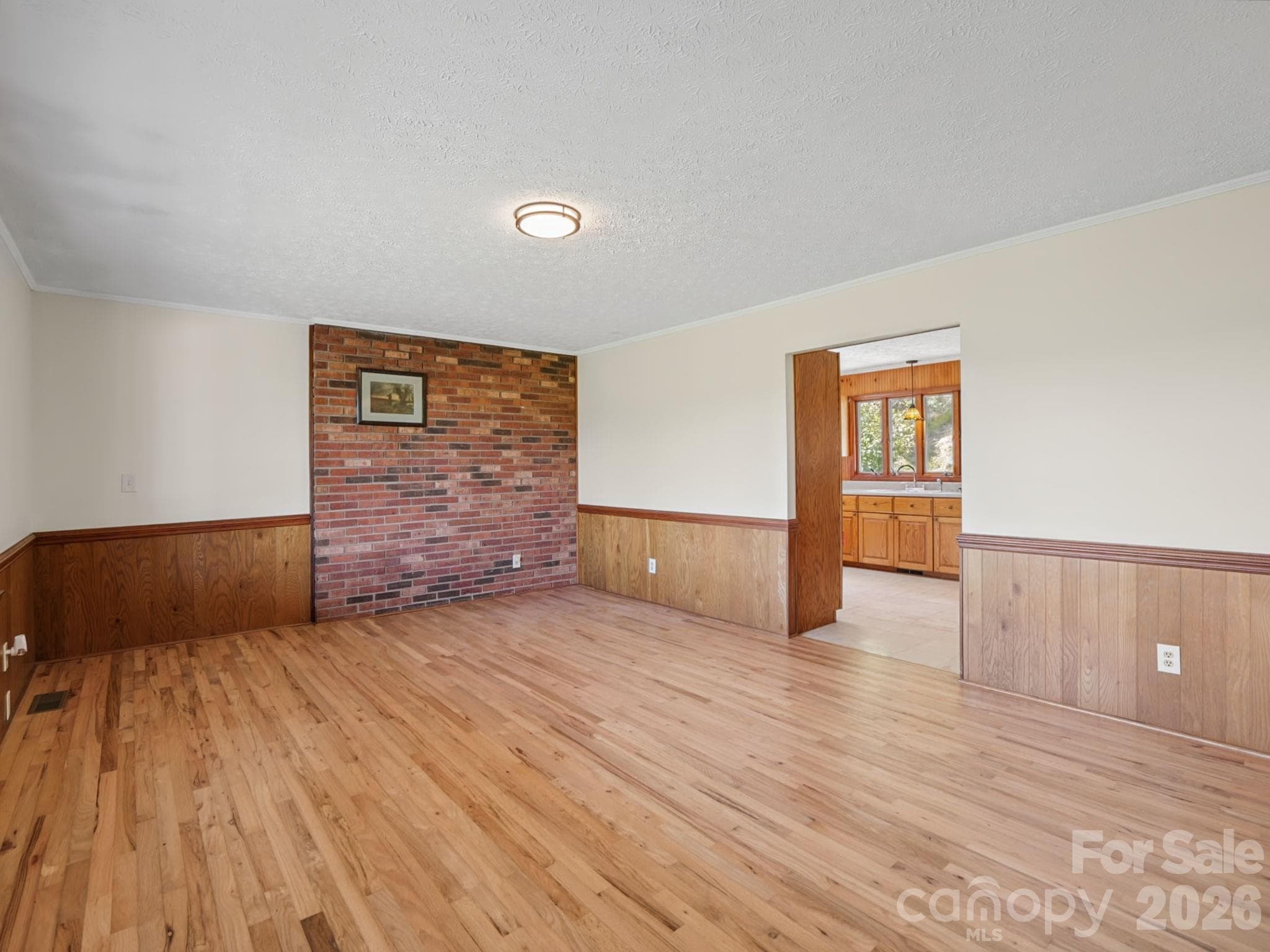 Living room with doorway to kitchen - 727 E Lyda Road, Hendersonville