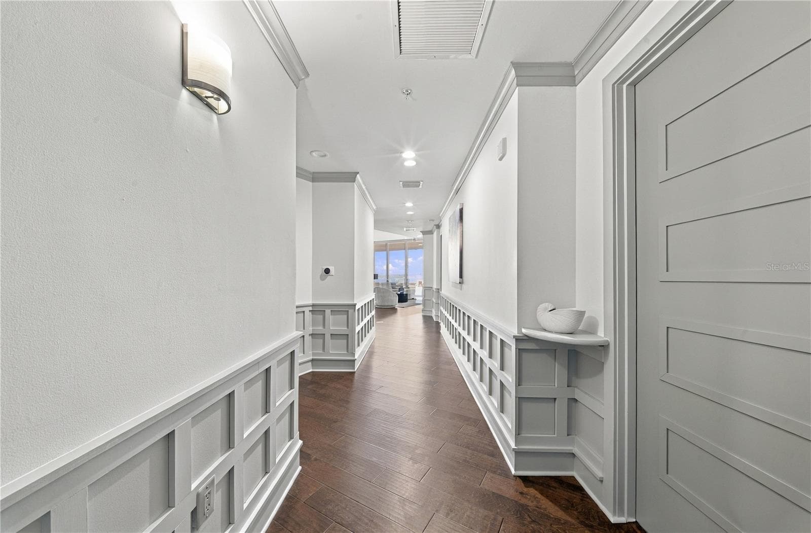 Long Foyer Entry | A defined arrival leads directly toward the light and skyline beyond - 260 S OSCEOLA AVE #1406, ORLANDO